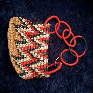 Stylish Woven Handbag with Red Accents